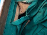 a piece of cloth in a suitcase with a hole in it