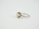 a close up of a ring on a white surface with a white background