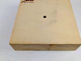 an image of a wooden box with a hole in it