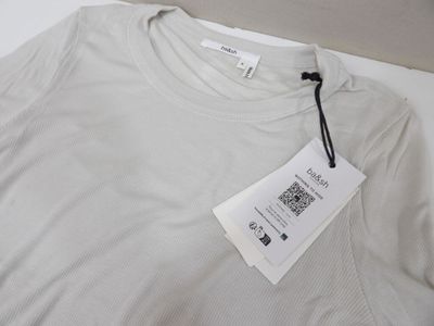 a white t - shirt with a tag attached to it