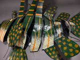 a green and yellow fish made out of paper