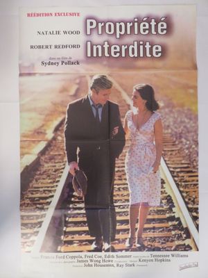 affiche de film représentant un homme et une femme marchant sur une voie ferrée