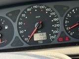 a close up of a car dashboard with a clock on it
