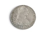 a close up of a coin on a white surface with a white background