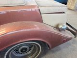 an old car that is sitting in the garage