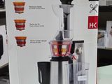 une boîte sur laquelle est représenté un extracteur de jus