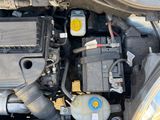 a picture of a car ' s engine with its hood open