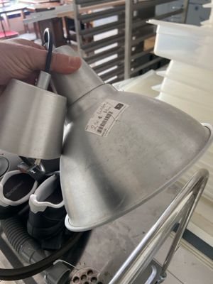 a person that is holding a metal object in their hand