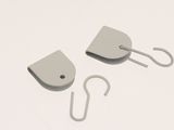 two hooks and a hook on a white surface