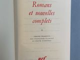 a book open to a page with a red writing on it