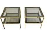 pair of brass and glass side tables with glass shelves