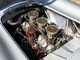 a silver car with a engine in it ' s trunk