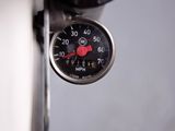 a close up of a gauge on the side of a vehicle