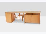 an image of a desk with two chairs and a desk top