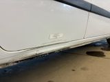 a close up of a car ' s tire with a sticker on it