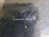 a close up of a metal plate with a logo on it