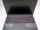 a laptop that is open on a white surface
