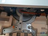 someone is using a circular cutter to cut a piece of wood