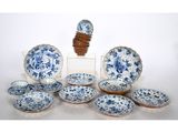 a group of blue and white plates and bowls