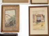 many paintings on the wall of this room