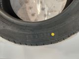 a tire that has a yellow dot on the side of it