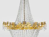 a gold and crystal chandelier hanging from a ceiling