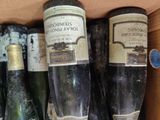 many bottles of wine in a box on the shelf