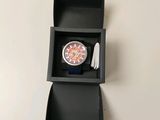 a box with a watch inside of it on a table