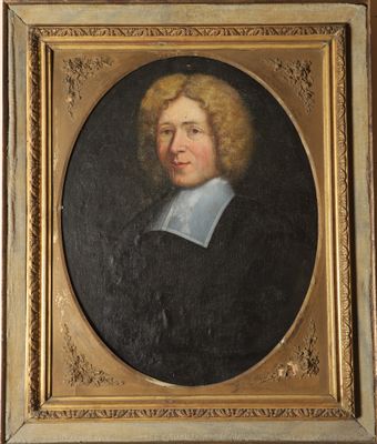 portrait of a man in a black coat with a white collar