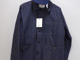 an image of a blue jacket and hat hanging on a wall