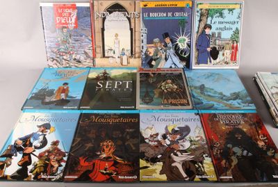 plusieurs livres sont empilés sur une table