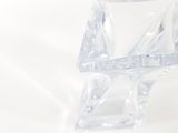 a clear glass vase sitting on a white surface