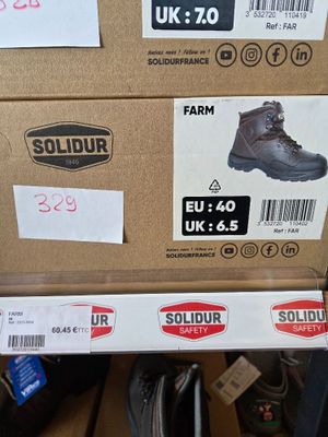 boxes of shoes are stacked on top of each other in a store