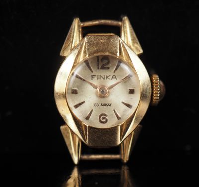 an image of a close up of a wrist watch on a black surface