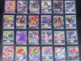 a close up of a bunch of pokemon cards on a table