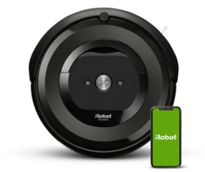 a black robot vacuum cleaner with a green battery next to it