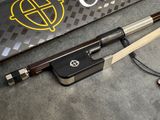 two chopsticks sitting next to a laptop on a table