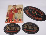 three vintage advertising signs on a white surface with a picture of a man and a woman