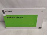 the box of the dogee tab g5 is sitting on a white surface