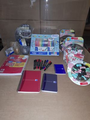 a table that has a lot of school supplies on it