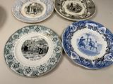 four plates with different designs on them on a table