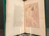 an open book with a drawing on it sitting on a table