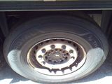 a flat tire on the back of a truck