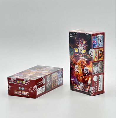 two boxes of pokemon trading cards on a white surface