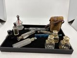 a tray that has a lot of glass items on it