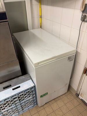 a refrigerator and a freezer in a small kitchen