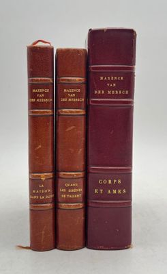 three books sitting on top of each other on a white surface