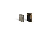 a couple of lighters sitting next to each other on a white surface