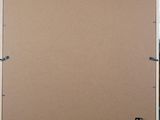an empty piece of cardboard is taped up on the wall