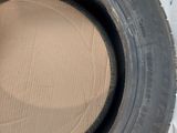 an image of a tire that is sitting on top of a cardboard box